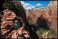 Hiker holds onto chain, Angels Landing. Zion National Park ( color)