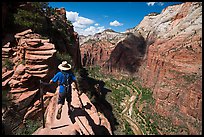 Hiker stepping next to sheer cliff, Angels Landing. Zion National Park ( color)