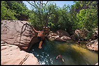 Man jumping into water, Pine Creek. Zion National Park ( color)