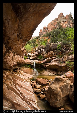 Striated alcove, waterfall, and rock towers, Pine Creek Canyon. Zion National Park, Utah, USA.