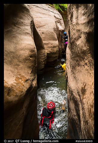 Canyoneers swim through narrows, Upper Left Fork. Zion National Park, Utah (color)