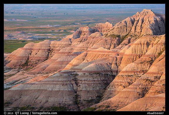 Eroded sedimentary rock layers at sunrise. Badlands National Park, South Dakota, USA.