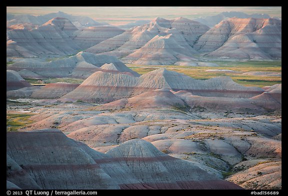 Delicately colored badlands and prairie at sunrise. Badlands National Park (color)