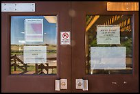 Rolling hills, White River Visitor Center window reflexion. Badlands National Park, South Dakota, USA. (color)