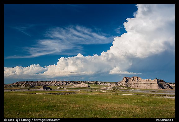 Afternoon clouds above buttes and prairie, South Unit. Badlands National Park, South Dakota, USA.