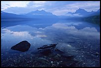 Rocks, peebles, and mountain reflections in lake McDonald. Glacier National Park, Montana, USA. (color)