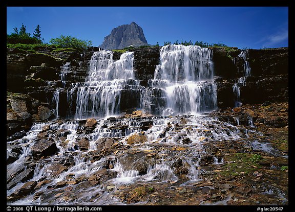 Waterfall at hanging gardens, with top of Mountain. Glacier National Park (color)