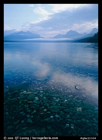 Pebbles, lake Mc Donald, and foggy mountain range, early morning. Glacier National Park (color)