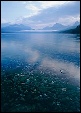 Pebbles, lake Mc Donald, and foggy mountain range, early morning. Glacier National Park ( color)
