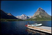 Deck and small boats on Swiftcurrent Lake. Glacier National Park, Montana, USA. (color)
