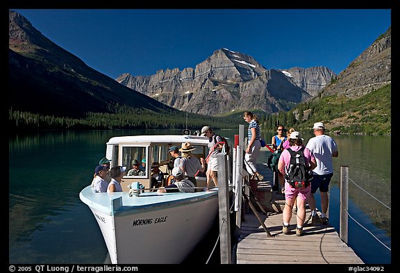 Passengers embarking on tour boat at the end of Lake Josephine. Glacier National Park, Montana, USA.