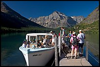 Passengers embarking on tour boat at the end of Lake Josephine. Glacier National Park, Montana, USA. (color)