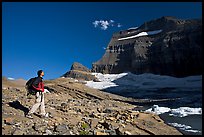 Hiker on moraine near Grinnell Glacier. Glacier National Park, Montana, USA.