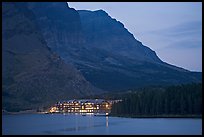 Swiftcurrent Lake and Many Glacier Lodge lights at dusk. Glacier National Park, Montana, USA.