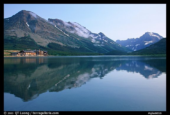 Many Glacier Hotel reflected in Swiftcurrent Lake. Glacier National Park, Montana, USA.