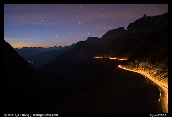 Going-to-the-Sun road at dusk with car lights. Glacier National Park (color)