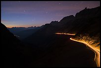 Going-to-the-Sun road at dusk with car lights. Glacier National Park ( color)