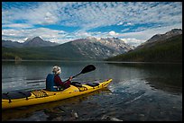 Kayaker paddles away from shore, Kintla Lake. Glacier National Park ( color)