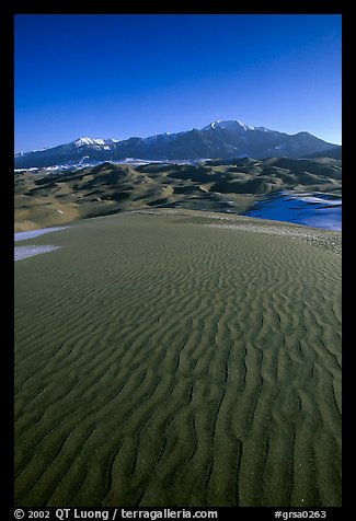 Sand ripples and Sangre de Christo mountains in winter. Great Sand Dunes National Park and Preserve, Colorado, USA.