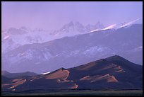 Distant view of the dune field and Sangre de Christo mountains at sunset. Great Sand Dunes National Park and Preserve, Colorado, USA.