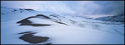 Dune field covered by snow. Great Sand Dunes National Park and Preserve (Panoramic color)