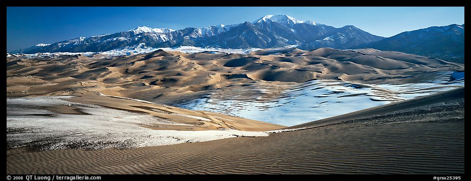Landscape of sand dunes and mountains in winter. Great Sand Dunes National Park and Preserve, Colorado, USA.