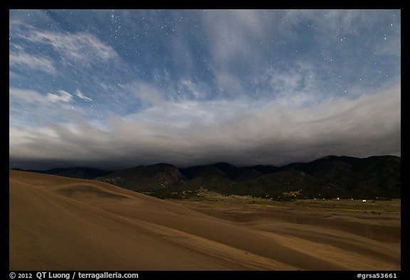 Dunes and clouds at night. Great Sand Dunes National Park and Preserve, Colorado, USA.