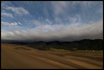 Dunes and clouds at night. Great Sand Dunes National Park and Preserve ( color)