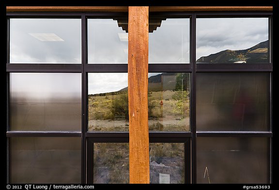 Grasslands and mountains, visitor center window reflexion. Great Sand Dunes National Park, Colorado, USA.