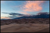 Dune field and Sangre de Cristo mountains with cloud lighted by sunset. Great Sand Dunes National Park and Preserve ( color)
