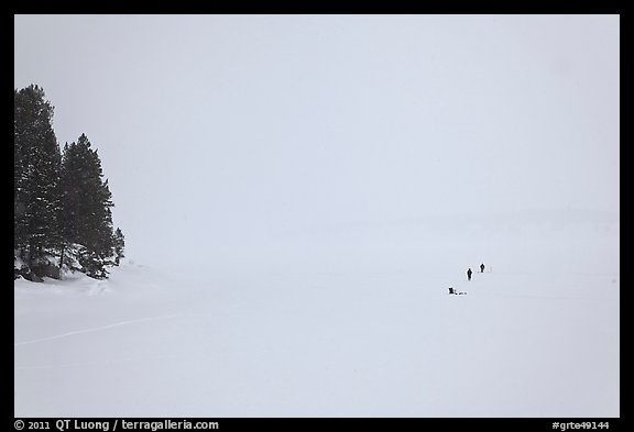 Frozen Jackson Lake in white-out, ice fishermen. Grand Teton National Park (color)