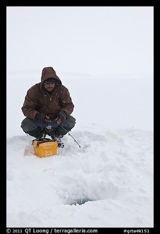 Ice fishing during a snow storm, Jackson Lake. Grand Teton National Park (color)