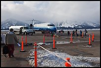 Passengers walking towards plane on Jackson Hole Airport. Grand Teton National Park ( color)