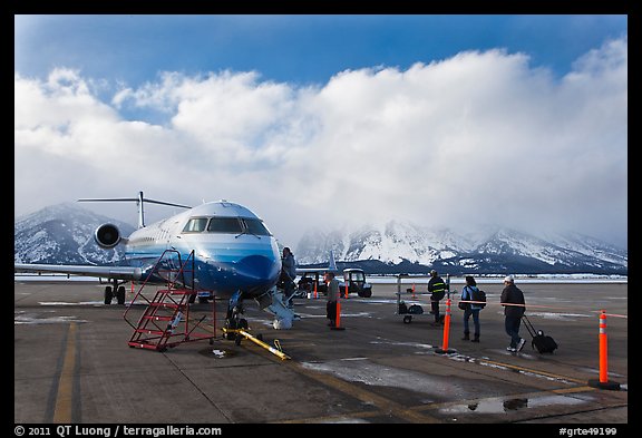 Passengers boarding aircraft, Jackson Hole Airport, winter. Grand Teton National Park (color)