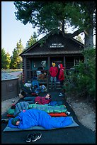 Outdoorsmen camping out in front of Jenny Lake Ranger Station for permits. Grand Teton National Park ( color)