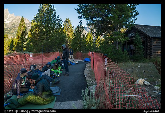 Hikers and climbers camped out in front of Jenny Lake Ranger Station for permits. Grand Teton National Park (color)