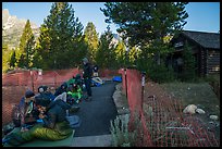Hikers and climbers camped out in front of Jenny Lake Ranger Station for permits. Grand Teton National Park ( color)