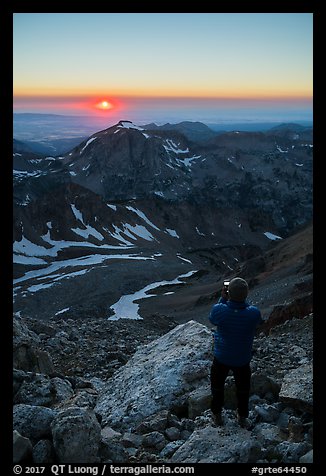 Mountaineer photographs sunset from Lower Saddle. Grand Teton National Park (color)