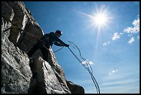 Climber throwing down ropes in preparation for rappel on Grand Teton. Grand Teton National Park ( color)