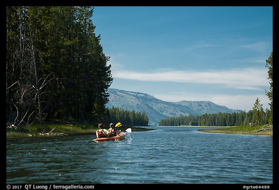 Kayakers approach narrow channel, Colter Bay. Grand Teton National Park (color)
