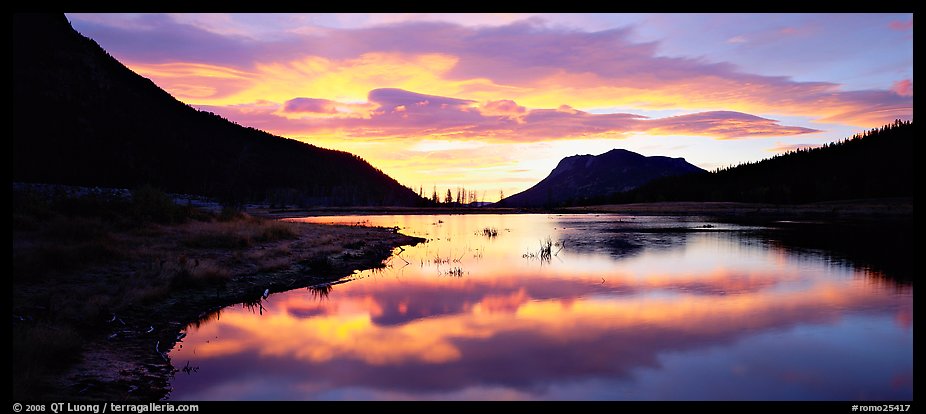 Cloud reflected in pond at sunrise. Rocky Mountain National Park, Colorado, USA.