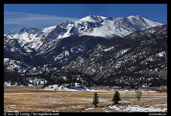 Thawing meadow and snowy peaks, late winter. Rocky Mountain National Park, Colorado, USA.