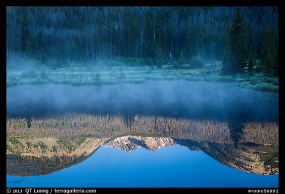 Mist and Never Summer Mountains reflection. Rocky Mountain National Park, Colorado, USA.
