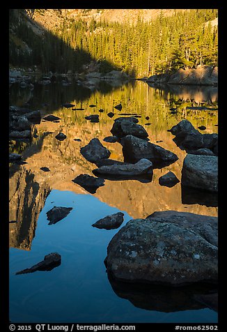 Boulders and reflections in Dream Lake. Rocky Mountain National Park, Colorado, USA.