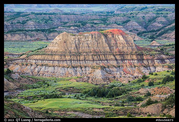 Butte with red scoria cap, Painted Canyon. Theodore Roosevelt National Park, North Dakota, USA.