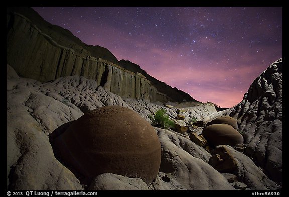 Cannonball and badlands with night starry sky. Theodore Roosevelt National Park, North Dakota, USA.