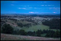 Rolling hills with distant lightening storm at dusk. Wind Cave National Park ( color)