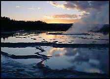Great Fountain Geyser with residual steam at sunset. Yellowstone National Park ( color)