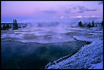 West Thumb Geyser Basin covered by snow at dusk. Yellowstone National Park, Wyoming, USA. (color)