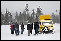 Travelers boarding snow bus. Yellowstone National Park, Wyoming, USA. (color)